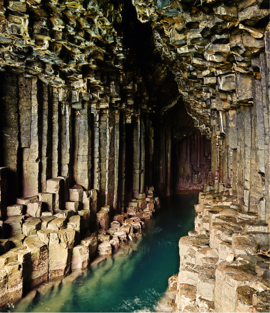 Stunning Rock Formations of Fingal’s Cave A close-up view of the hexagonal basalt columns inside Fingal's Cave, Scotland, with crystal-clear water flowing between the rock formations.